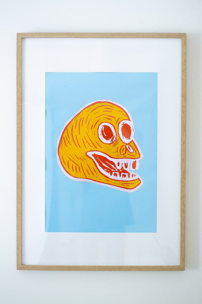 Blue linocut poster print with a yellow and red skull